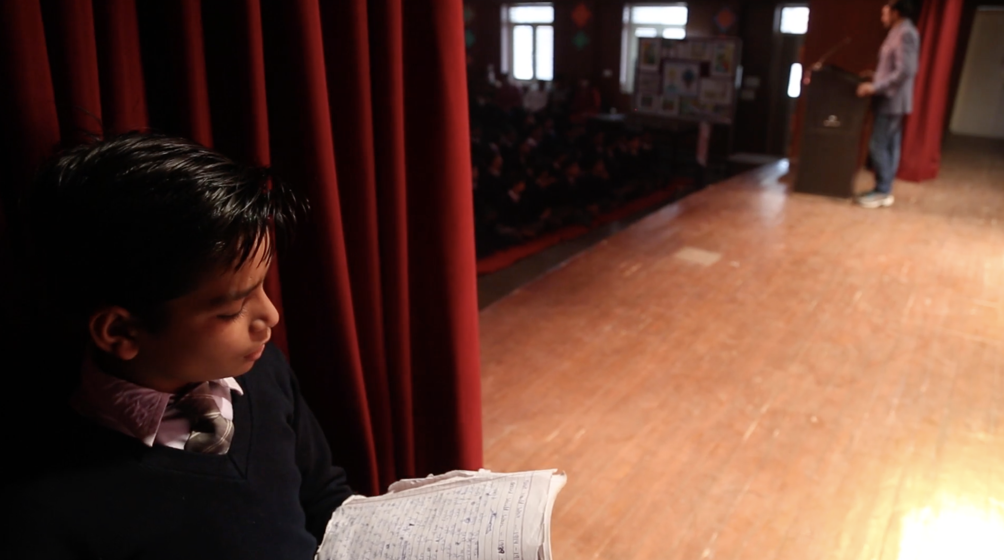 Young boy practicing his speech.