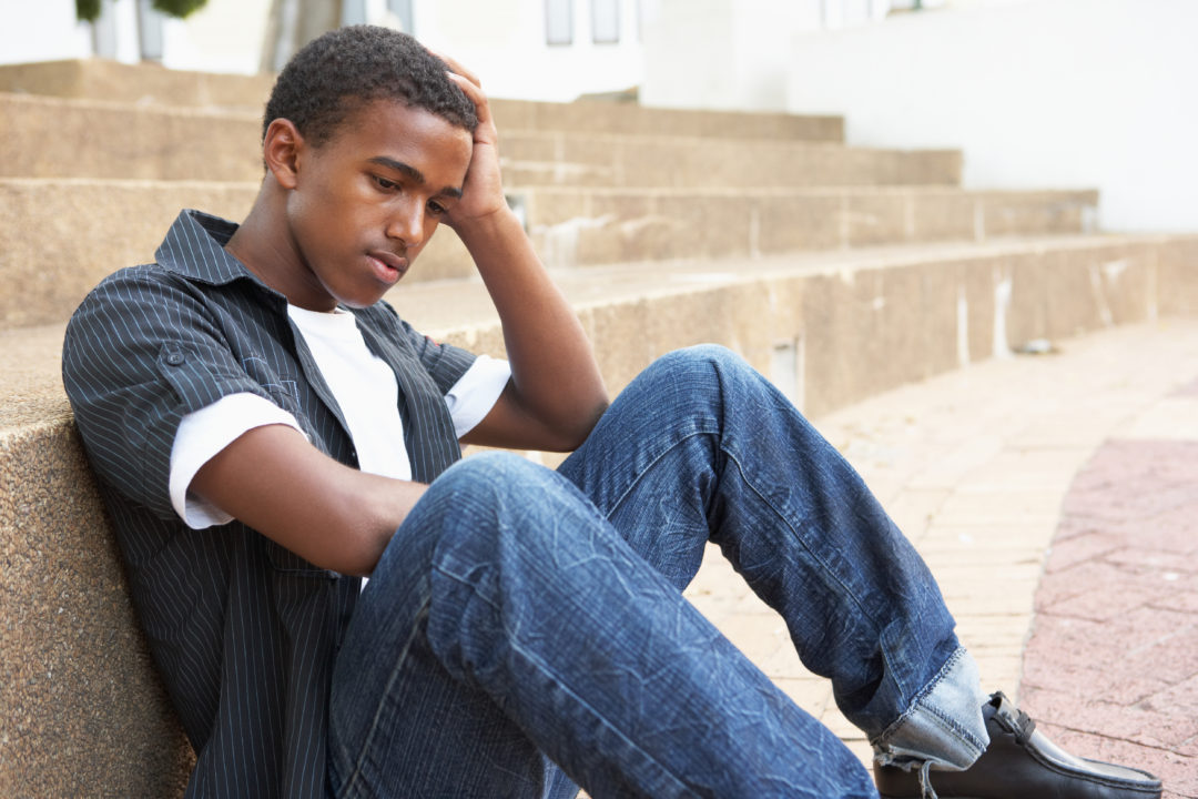 boy sitting on steps